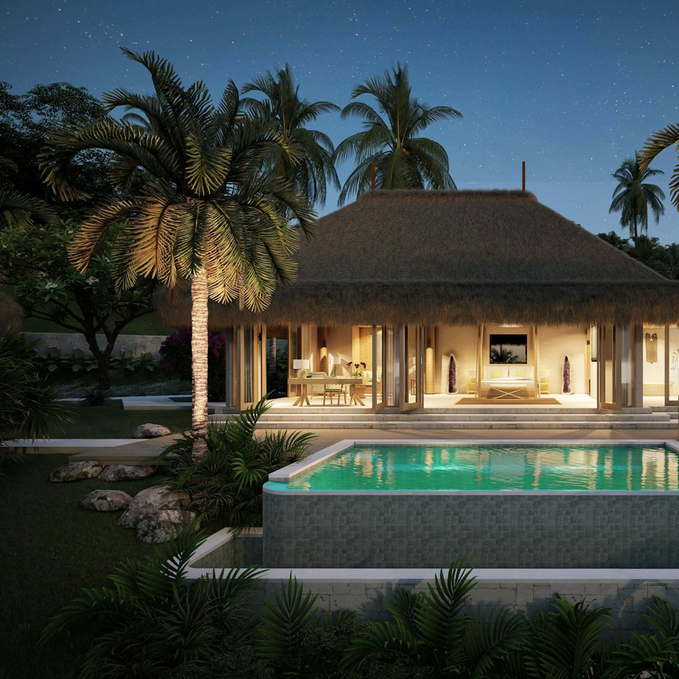 Villa de lujo con iluminación cálida al anochecer